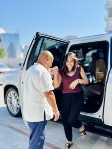 lady arriving from a luxury car