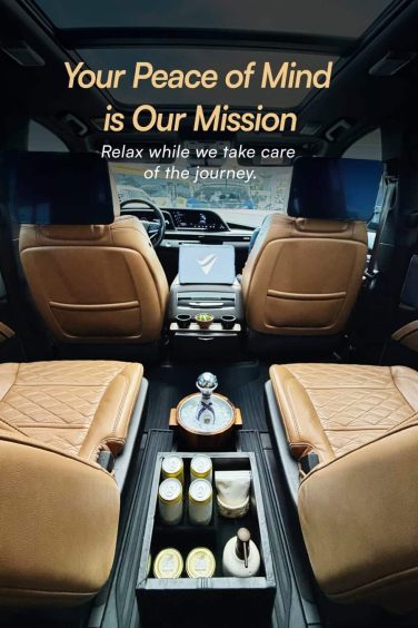 Elegant luxury car interior with soft leather upholstery, ambient lighting, and modern amenities for a sophisticated Cancun airport transportation.